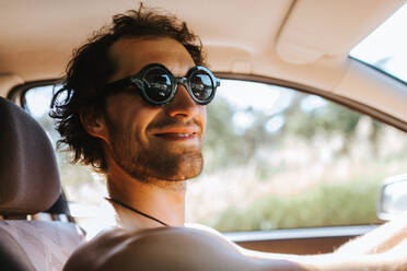 Close-Up Of Smiling Man Sitting In Car - EYF05350