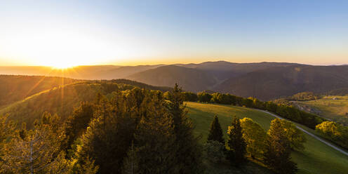 Germany, Baden-Wurttemberg, Sunrise over Black Forest range seen from Schauinsland mountain - WDF06023