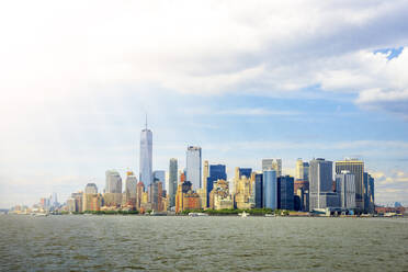 USA, New York, New York City, Sunlight illuminating Manhattan skyline - PUF01897