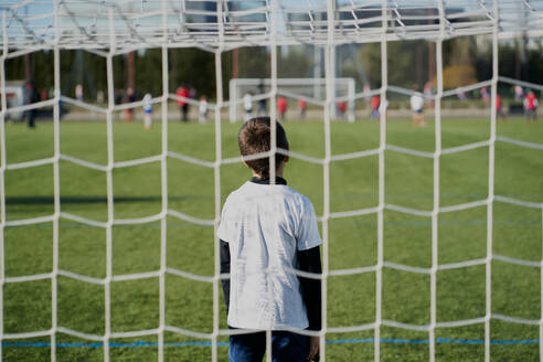 Gatekeeper children soccer player in action. stadium - CAVF85002