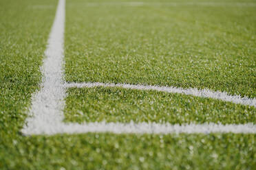 White line football corner on green field - CAVF85005