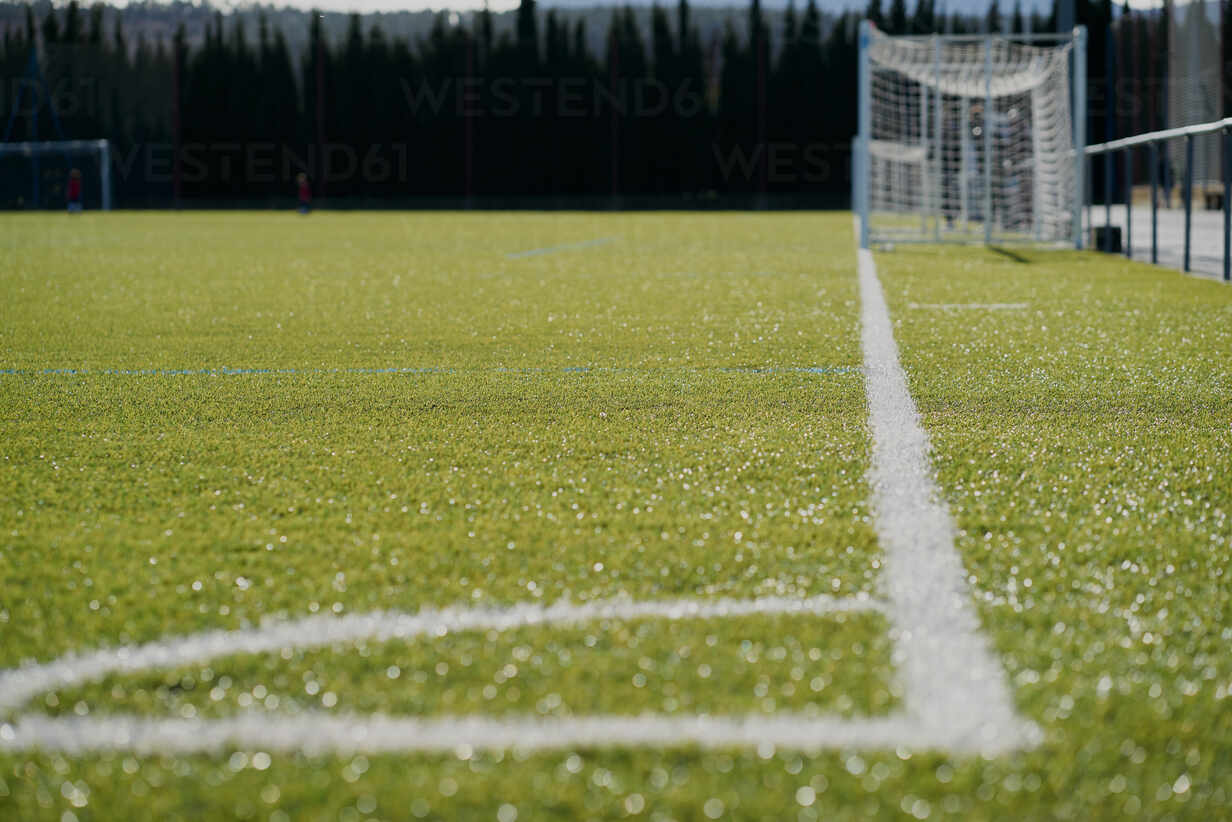 Green Synthetic Grass Sports Field with White Line Stock Photo