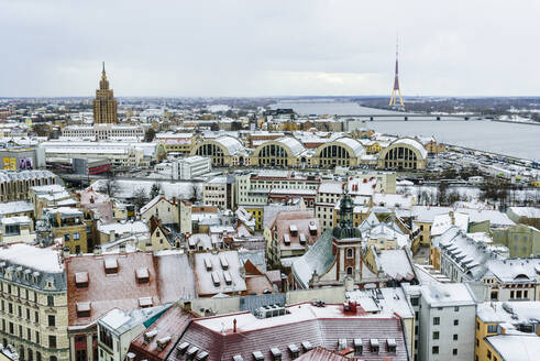 View over Riga Old Town city centre and Daugava River, with snow covered rooftops, UNESCO World Heritage Site, Riga, Latvia, Europe - RHPLF15306