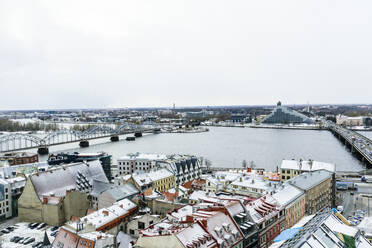 View over Riga Old Town city centre and Daugava River, with snow covered rooftops, UNESCO World Heritage Site, Riga, Latvia, Europe - RHPLF15307