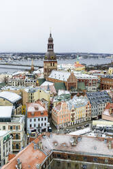 View over Riga Old Town city centre and Daugava River, with snow covered rooftops, UNESCO World Heritage Site, Riga, Latvia, Europe - RHPLF15310