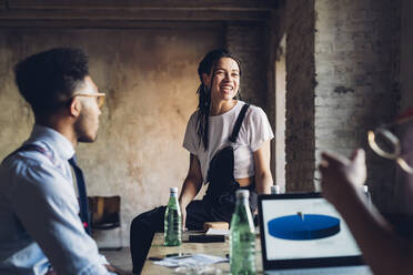 Creative team having business meeting in loft office - MEUF00638