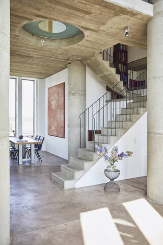 Interior of a loft flat with concrete stairs stock photo