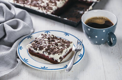 Mug of coffee and slice of black forest cake stock photo