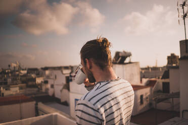 Man Drinking Coffee At Balcony - EYF05468