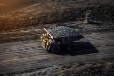 High Angle Blurred Motion of Truck With Coals Moving On Road - EYF05766