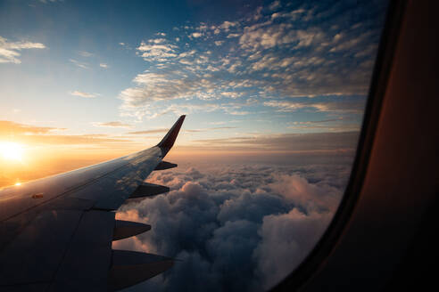 Scenic View Of Cloudscape Seen From Airplane Window - EYF05798