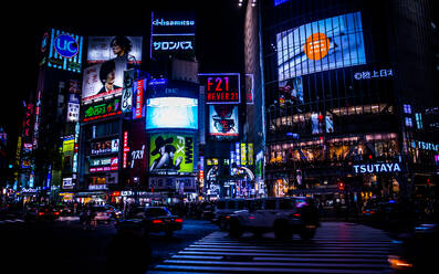 Vehicles On Street Against Illuminated Billboards On Buildings In Shibuya - EYF05815