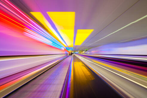 Blurred Motion Of Train At Illuminated Subway Station - EYF05869