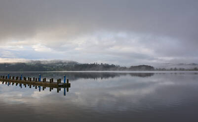 Pier at still lake in the British Lake District - CAVF85312