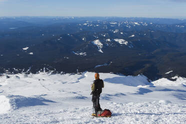 A man climbs to the summit of Mt. Hood in Oregon. - CAVF85327