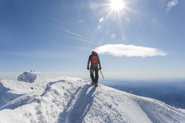 A man climbs to the summit of Mt. Hood in Oregon. - CAVF85334