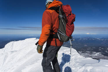 A man climbs to the summit of Mt. Hood in Oregon. - CAVF85343