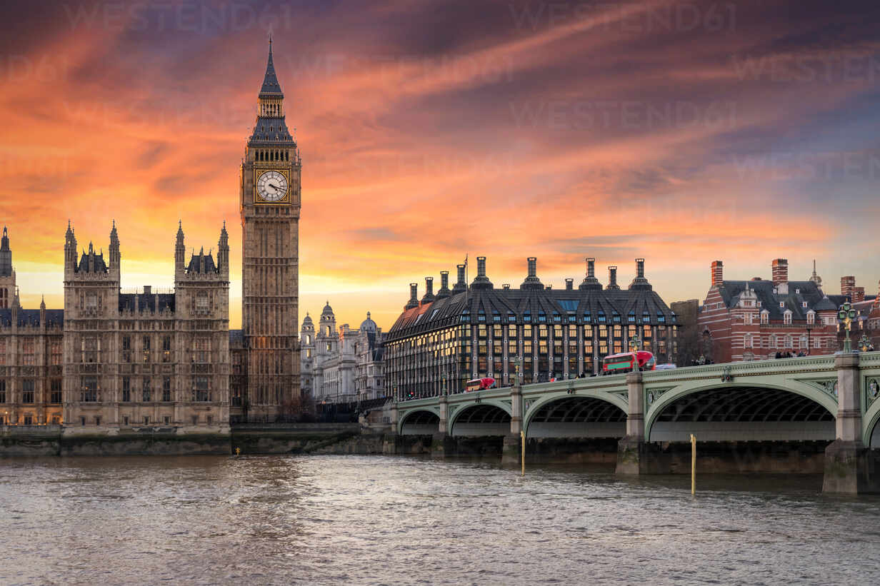 Westminster Bridge Over Thames River By Big Ben Against Cloudy Sky 