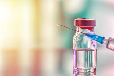 Close-Up Of Syringe And Vial Bottle On Table - EYF06076