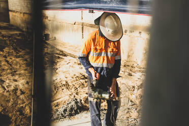 Man Working At Construction Site - EYF06362