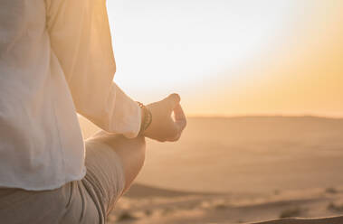 Woman Meditating In Desert - EYF06372