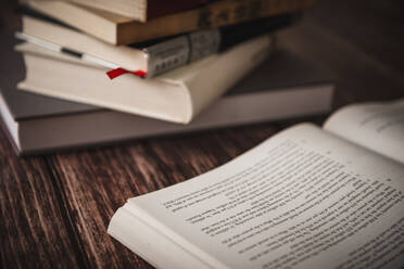 Stacked Books On Wooden Table - EYF06376