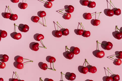 Fresh cherries on pink background - GEMF03872