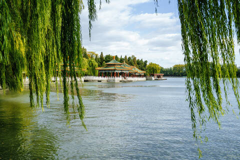 Scenic view of lake and temples against sky in Beihai Park, Beijing, China stock photo