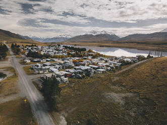 Lake Clearwater village with the Southern Alps in the background. NZ - CAVF85394