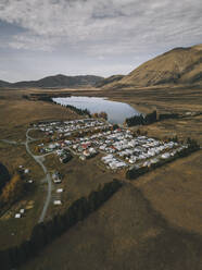 Lake Clearwater village with the Southern Alps in the background. NZ - CAVF85396