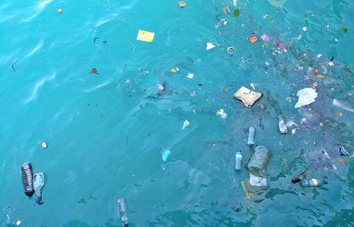 High Angle View of Garbage Floating On Water - EYF06563