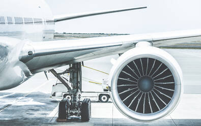 Close-Up Of Airplane Engine At Runway Against Sky - EYF06572
