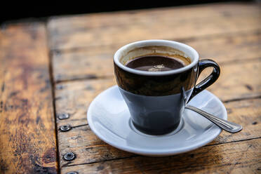 Close-Up Of Black Coffee On Wooden Table - EYF06620