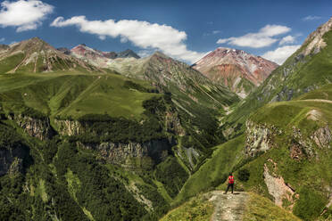 Rear View Of Woman Standing On Mountain - EYF06761