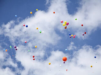 Low Angle View Of Ballons Flying Against Sky - EYF06859