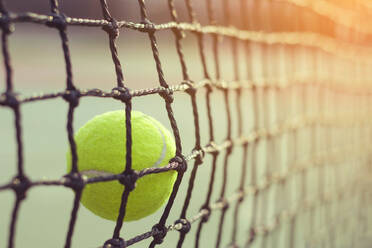 Close-Up Of Tennis Ball Hitting Net - EYF06883