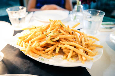 High Angle View Of French Fries In Plate On Table - EYF06911