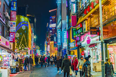 People Walking On Illuminated Street Amidst Buildings At Night - EYF07032