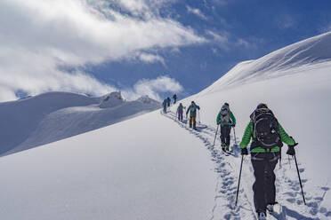 People On Snowcapped Mountain Against Sky - EYF07235