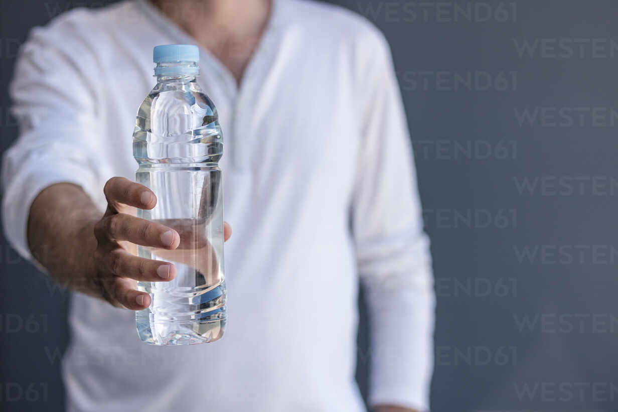 Man Holding Water Bottle Images – Browse 30,794 Stock Photos, Vectors, and  Video