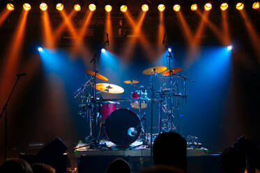 Illuminated Lights Falling On Drums At Stage During Music Concert - EYF07448