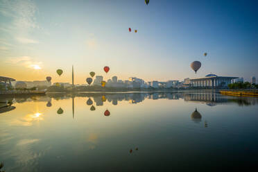 Hot Air Balloons Flying Over Lake - EYF07473