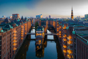 Illuminated Buildings In City At Waterfront - EYF07578