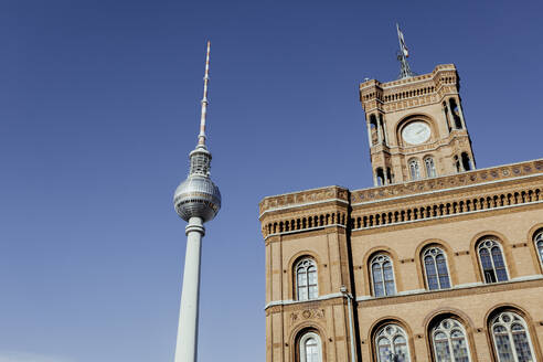 Germany, Berlin, Mitte, Town hall (Rotes Rathaus) and television tower at Alexanderplatz - ZMF00490