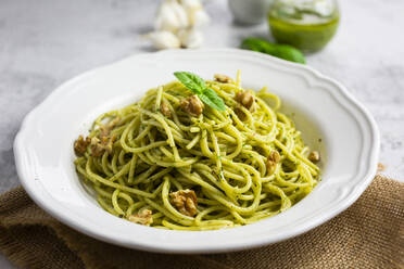 Spaghetti with pesto, walnut, basil and chilli and grana cheese - GIOF08498
