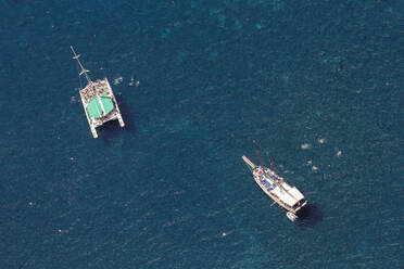 Portugal, Aerial view of tourboat and catamaran sailing on blue waters of Atlantic Ocean - WDF06098