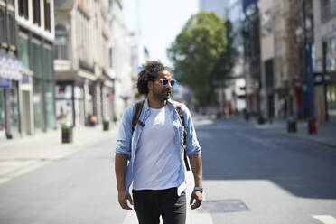 Portrait of young man in the city, Oxford Street, London, UK - PMF01134