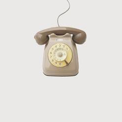 Close-Up Of Retro Styled Telephone Against White Background - EYF07596