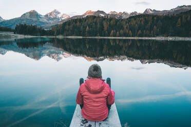 Rear View Of Woman Looking At Lake During Winter - EYF07667