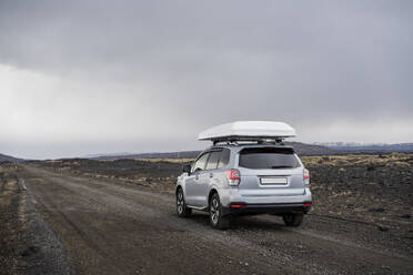 Car driving on gravel road in Iceland - CAVF85782